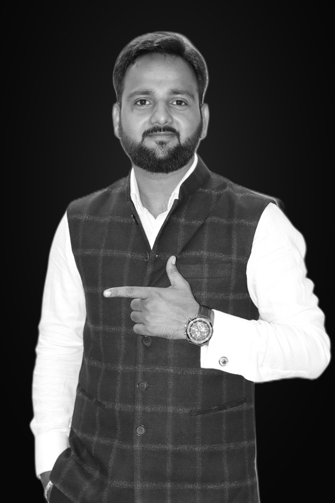 Coach Rahul Awasthi, Funnel Architect, pointing to his watch in a Nehru jacket