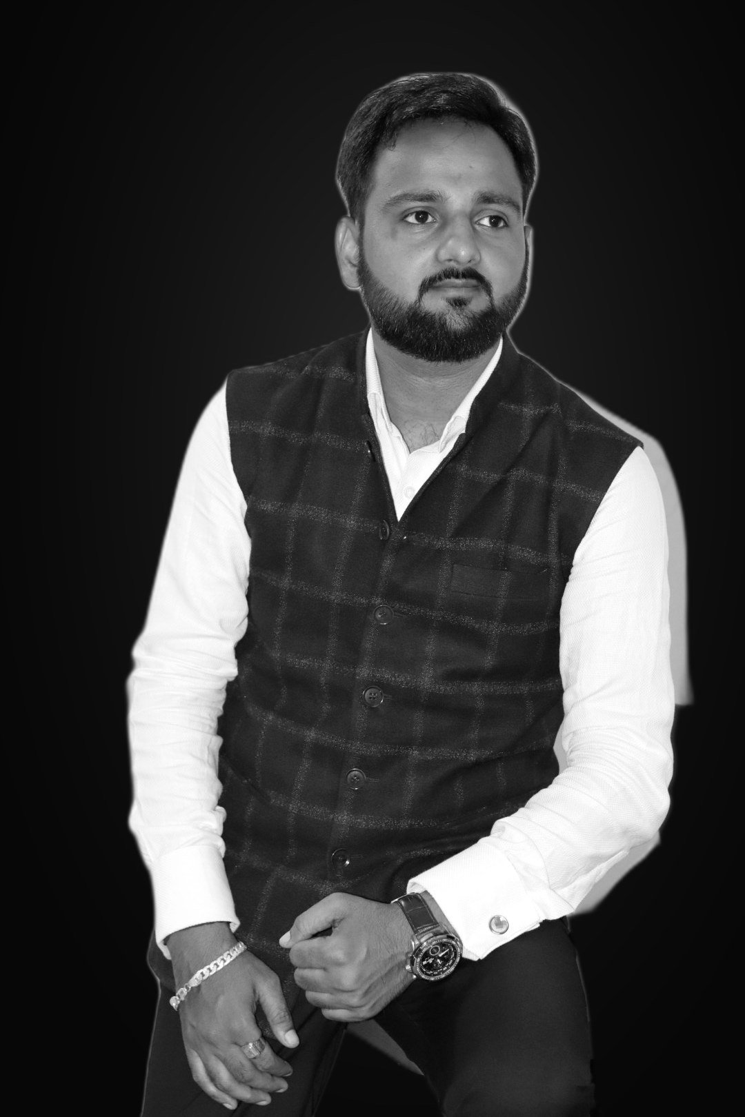 Rahul Awasthi, AI marketing coach and workshop speaker, seated by a whiteboard