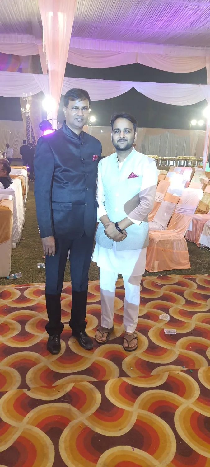 Rahul Awasthi in a white nehru jacket at an evening celebration