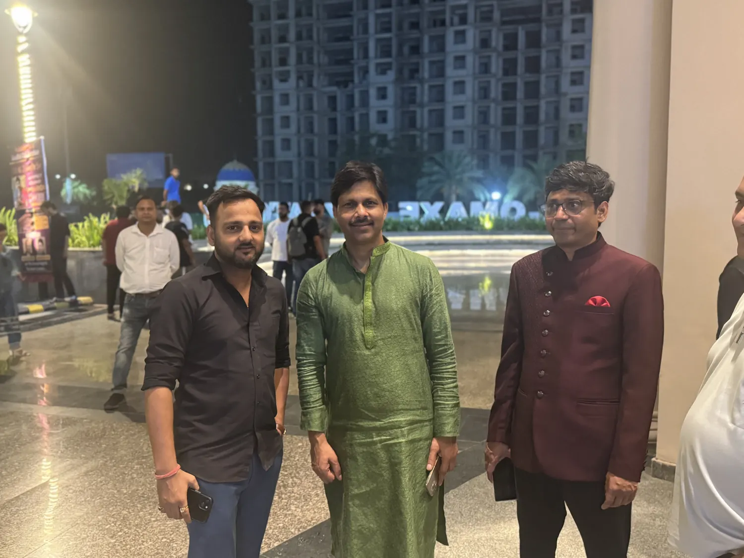 Rahul Awasthi posing with guests at an evening event